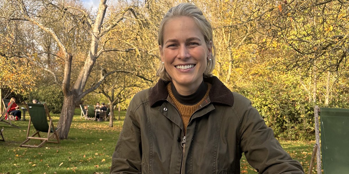 Head shot of Betsy Nilan-Sakakini in a park surrounded by trees