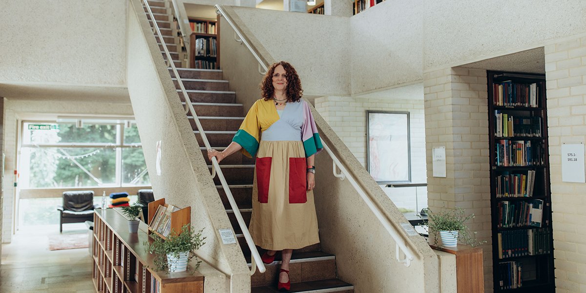 Maggie O'Farrell standing on a staircase in Rosemary Murray Library.