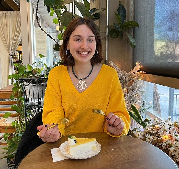 Louisa Hailey eating cake and smiling