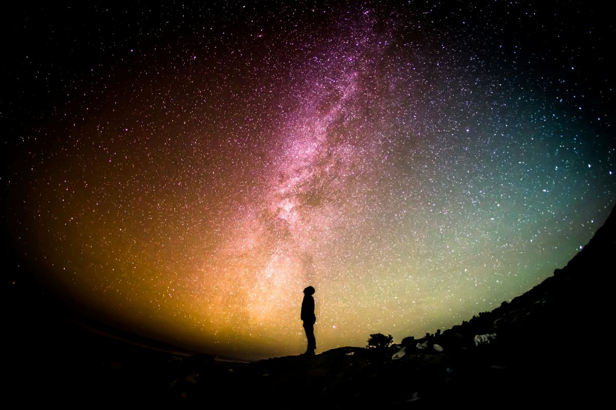 Shadow of a man against the night sky, stargazing