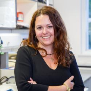portrait photograph of dr tereza cintrova-davies in a laboratory wearing a dark colour jumper
