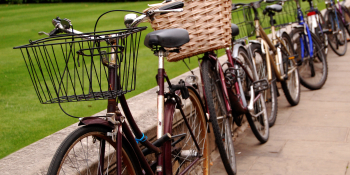 Close up of bicycles leaning against a wall