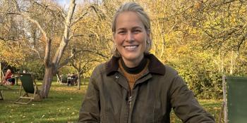 Head shot of Betsy Nilan-Sakakini in a park surrounded by trees