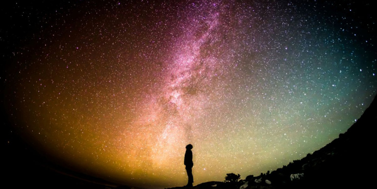 Shadow of a man against the night sky, stargazing