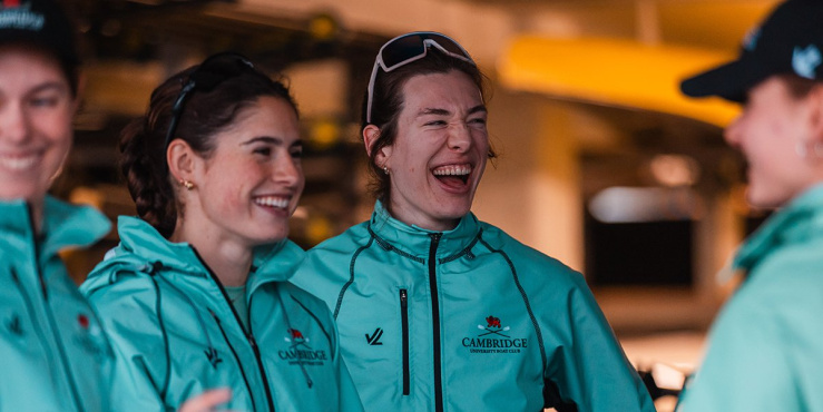 Izzy Campbell laughing with team mates in Cambridge blue.