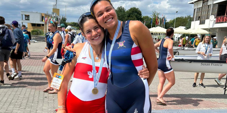 Izzy Campbell and rower from USA team posing for a photo.
