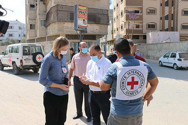 Emma Houiellebecq in a Gazan street with medical professionals