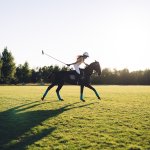 Woman playing polo