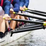 4 rowers rowing a boat
