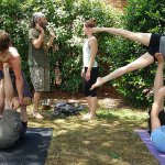 People doing yoga together outdoors in Richmond USA in 2015