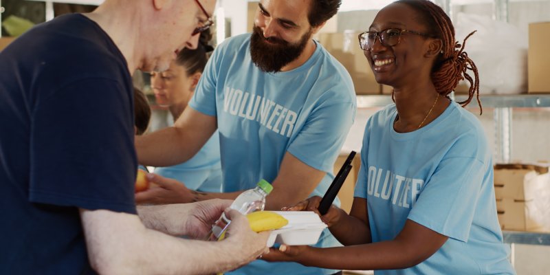 photo of 2 volunteers at a food bank