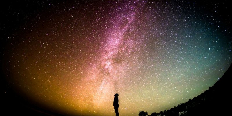 Shadow of a man against the night sky, stargazing