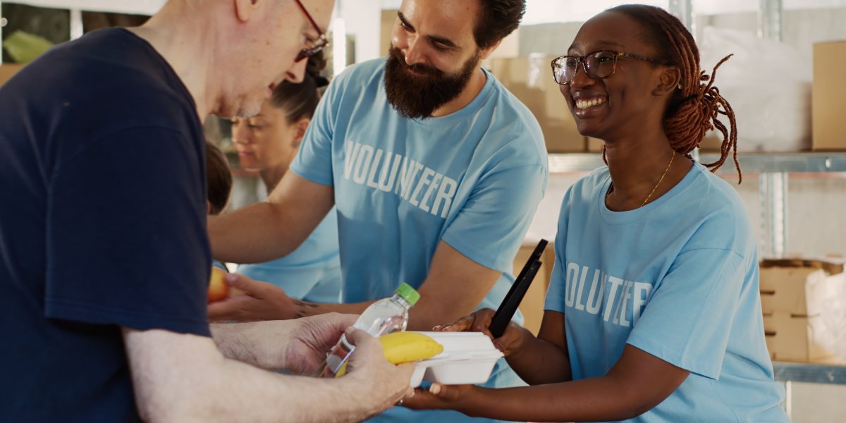 photo of 2 volunteers at a food bank