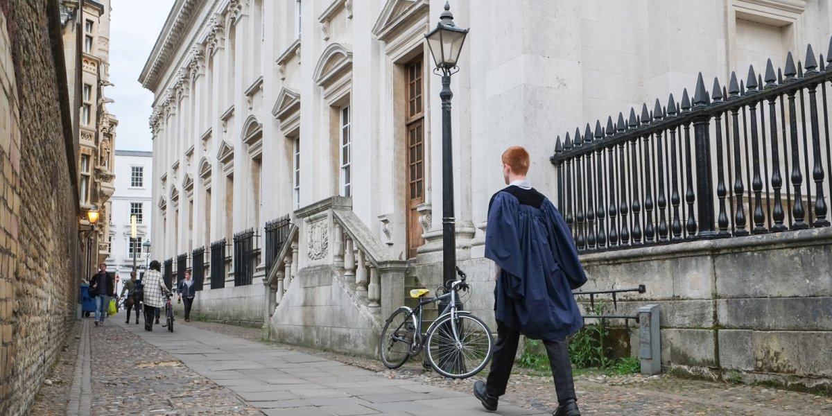 a student walked by the Senate house